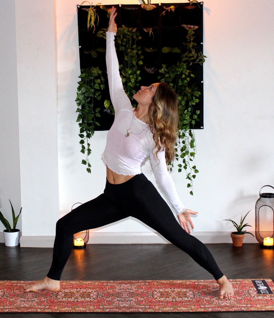 Woman doing yoga stretching upwards