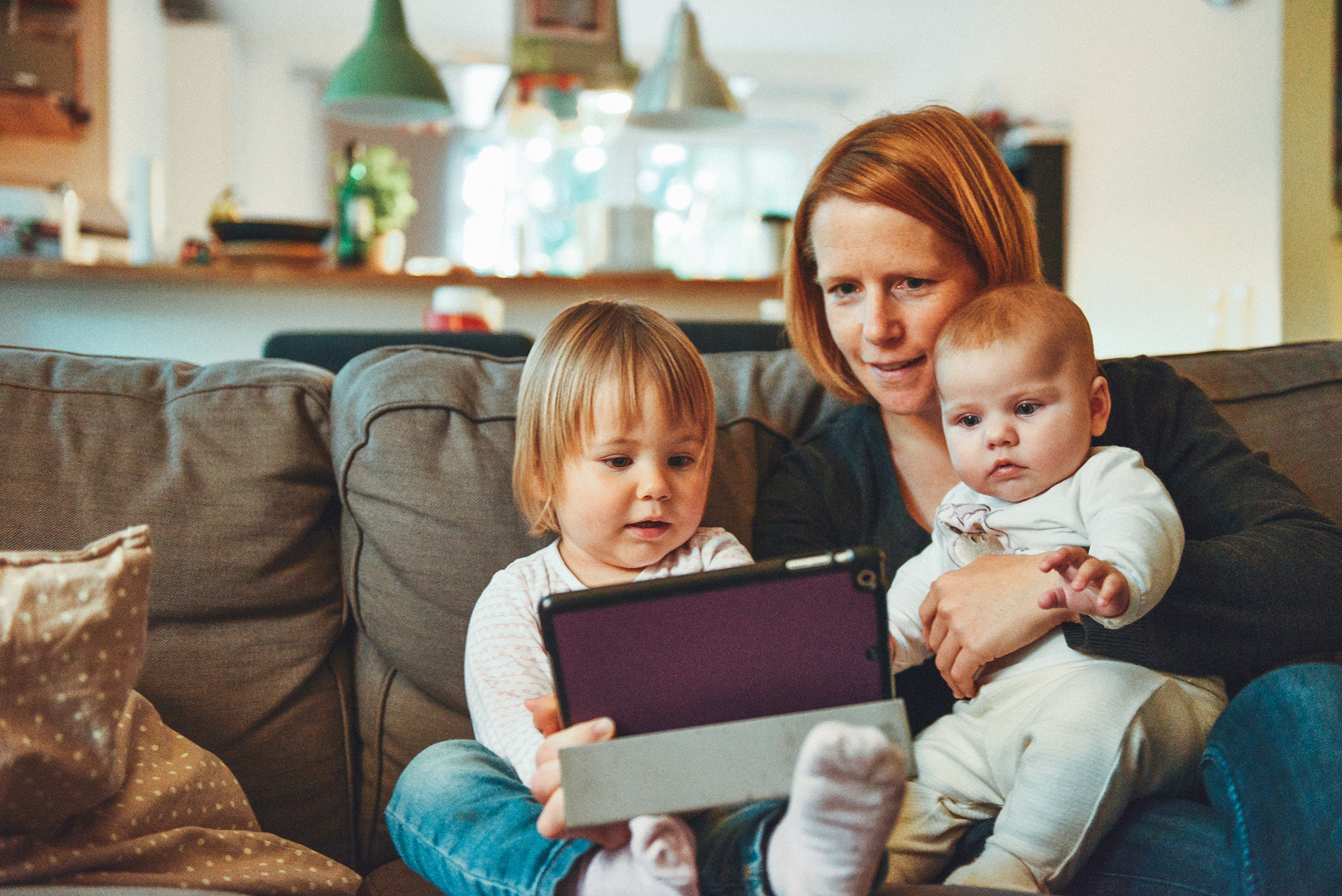 small business owner visiting a website with her children